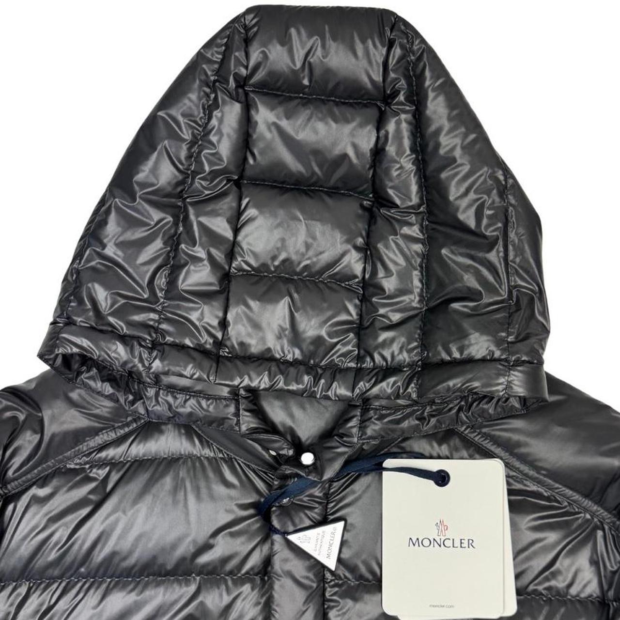 Moncler grey down nylon hooded puffer jacket with logo patch and quilted design.