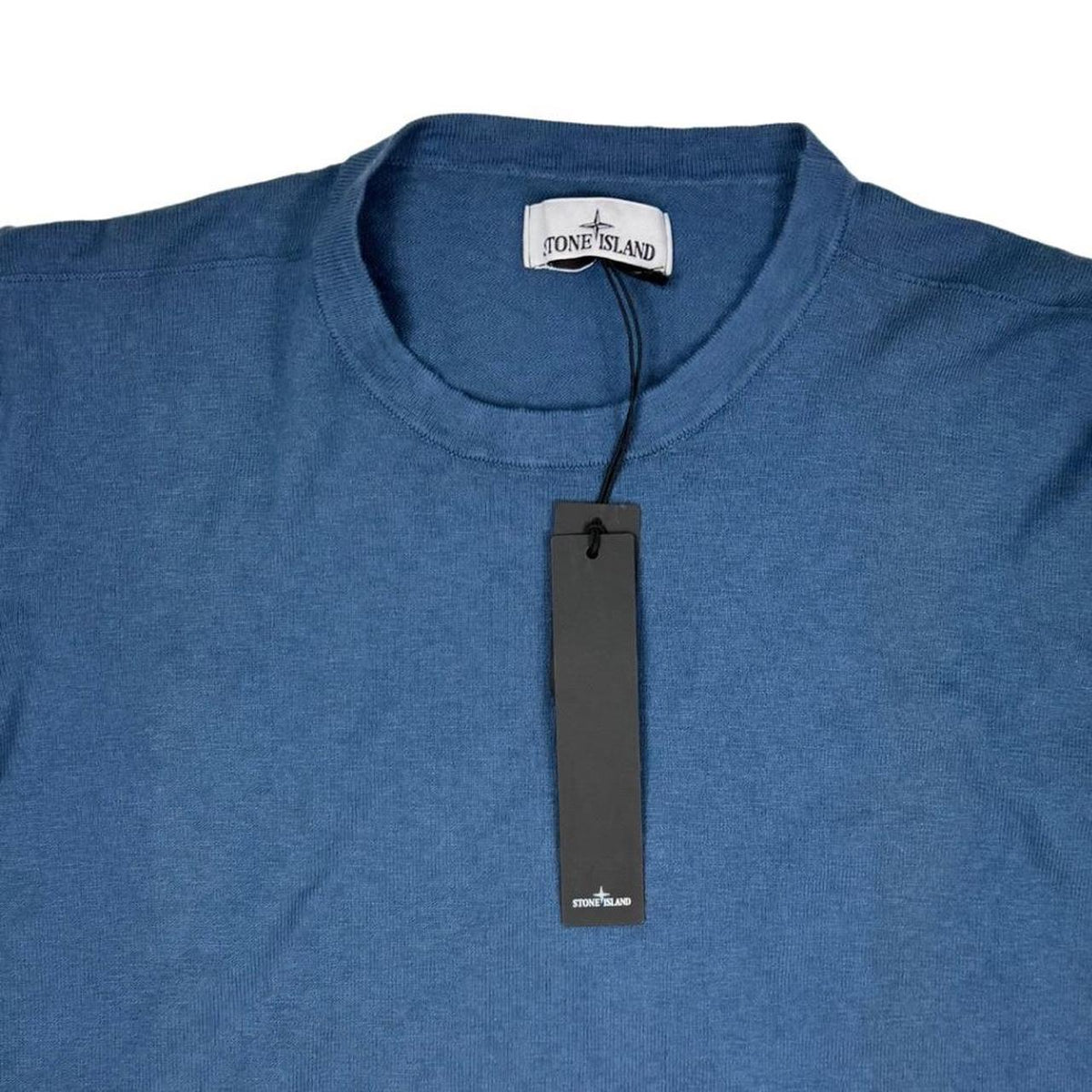 Stone Island blue organic cotton knit jumper with logo patch and ribbed detailing.