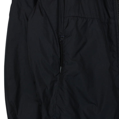 Stone Island black jacket with crinkle texture and logo patch on sleeve.