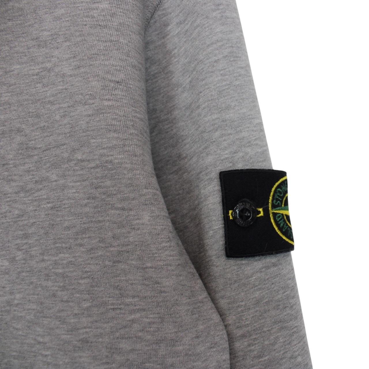 Stone Island grey cotton sweatshirt with logo patch and soft texture.