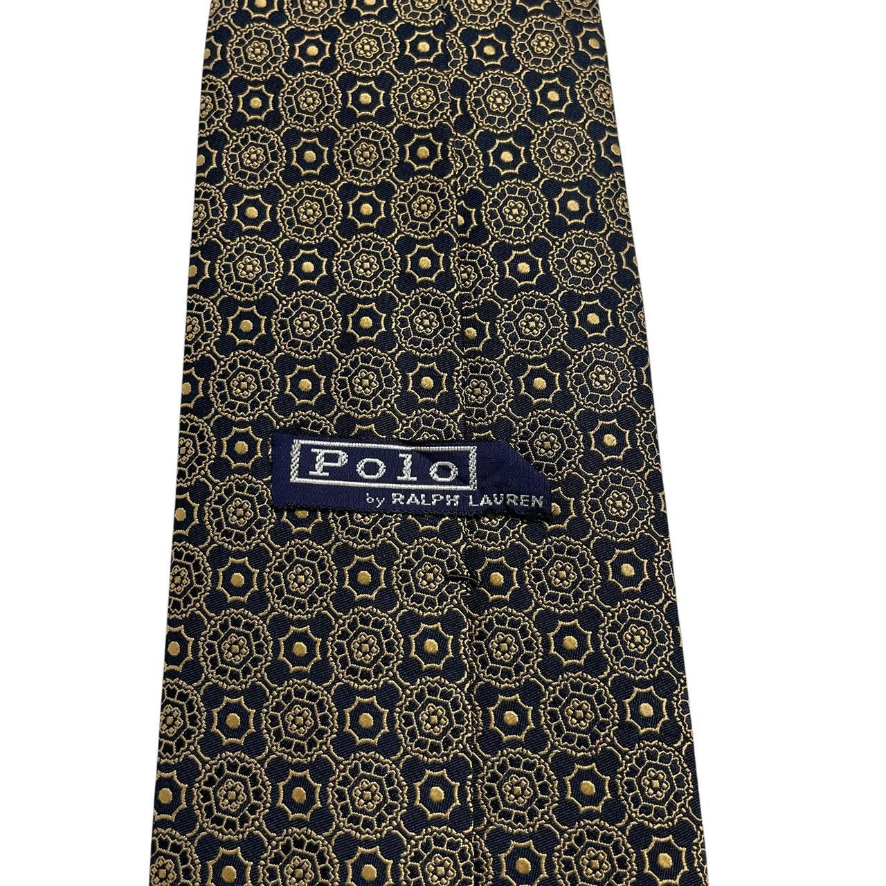 Polo Ralph Lauren black and gold silk tie with geometric print design.