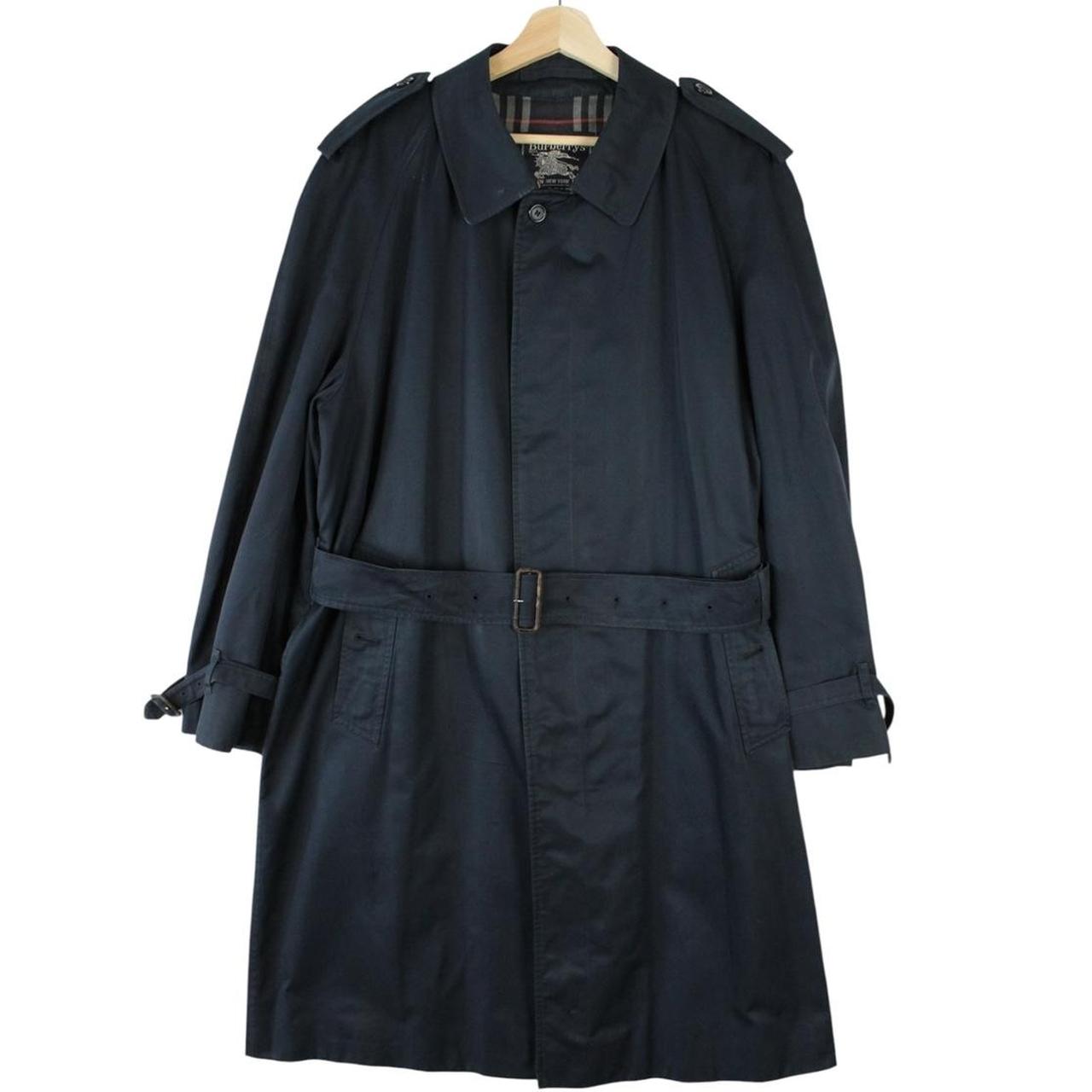 Burberry navy blue trench coat with belted waist and single breasted design.
