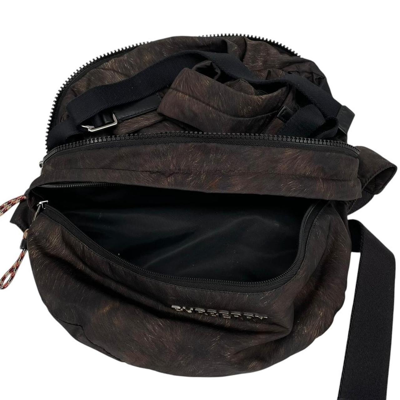 Burberry brown and black convertible bum bag with ape logo and durable material.