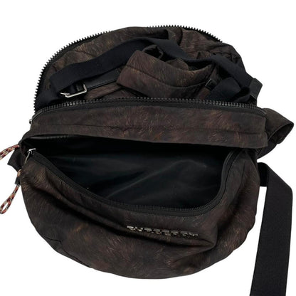 Burberry brown and black convertible bum bag with ape logo and durable material.