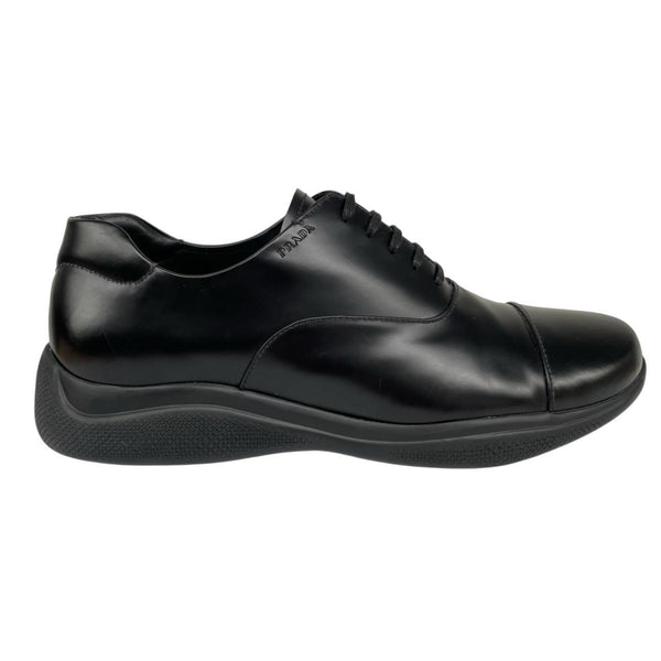 Prada black leather laced derby loafers with subtle signs of wear, includes original dust bags.
