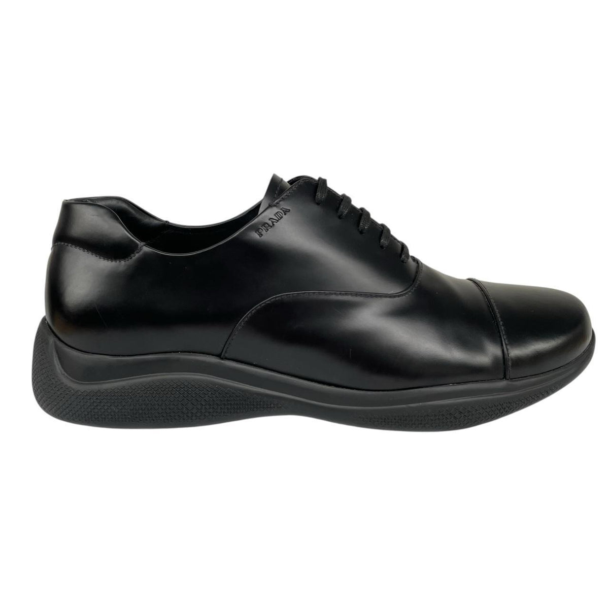 Prada black leather laced derby loafers with subtle signs of wear, includes original dust bags.