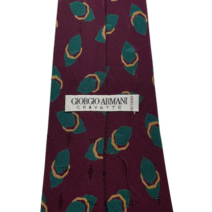 Giorgio Armani burgundy silk tie with geometric print and logo detail.