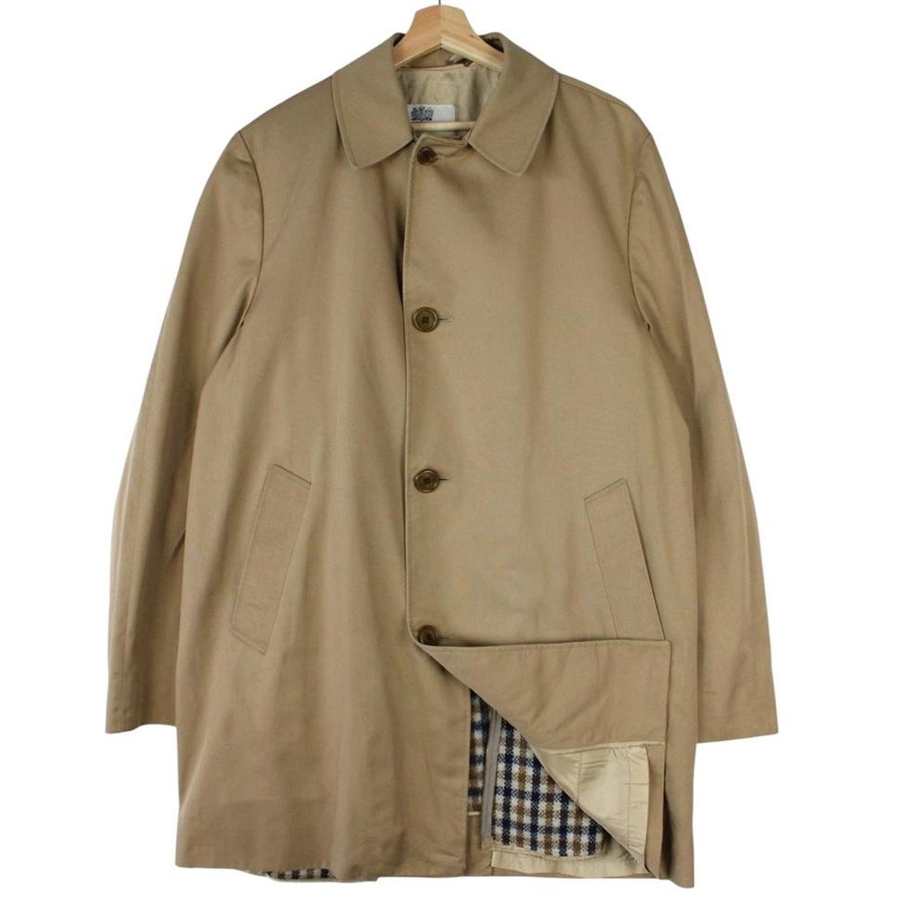 Aquascutum tan brown trench coat with house check pattern and removable wool lining.