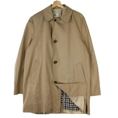 Aquascutum tan brown trench coat with house check pattern and removable wool lining.