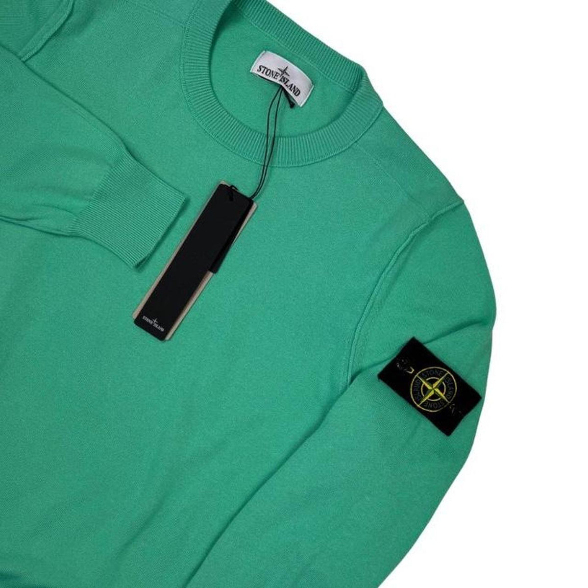 Stone Island green knit jumper made from organic cotton with logo patch detail.
