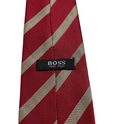 Hugo Boss red striped silk tie with subtle sheen and classic design.