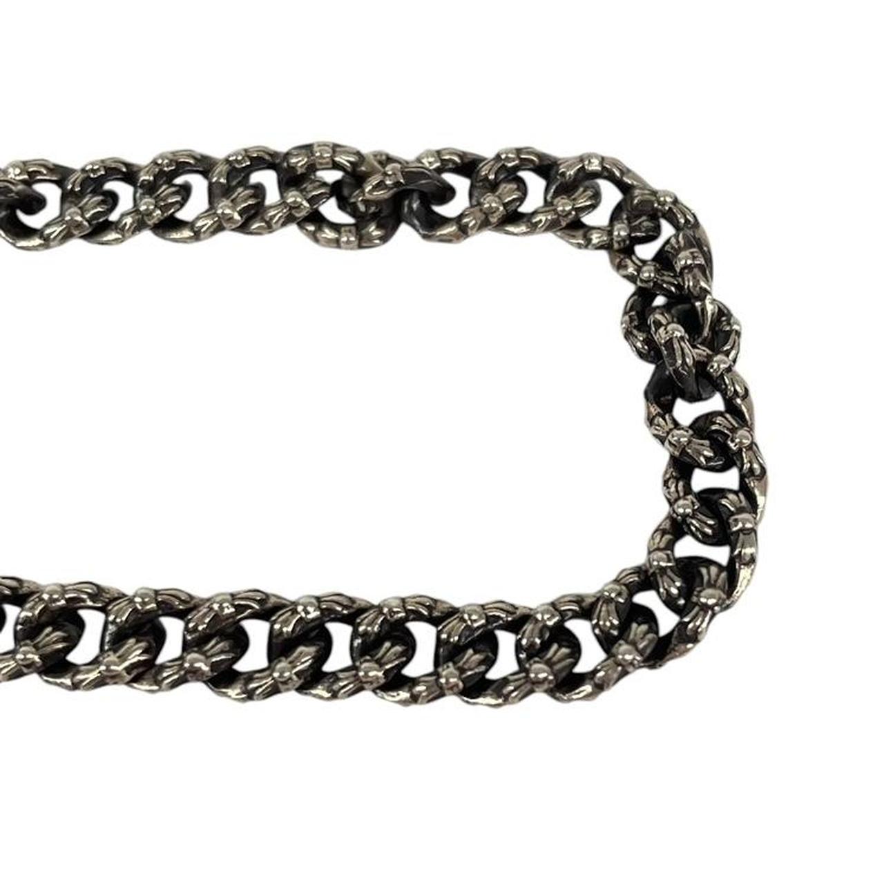 Chrome Hearts silver bracelet with intricate link design and logo detailing.