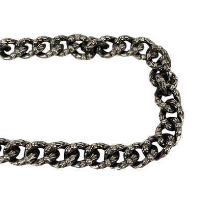 Chrome Hearts silver bracelet with intricate link design and logo detailing.