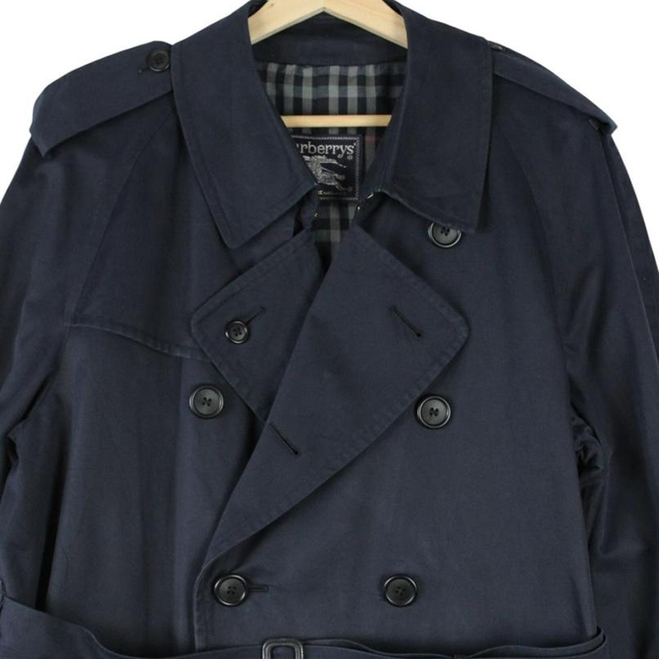 Burberry navy blue belted double breasted trench coat with classic check lining.