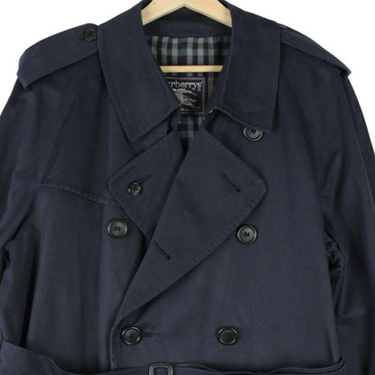 Burberry navy blue belted double breasted trench coat with classic check lining.