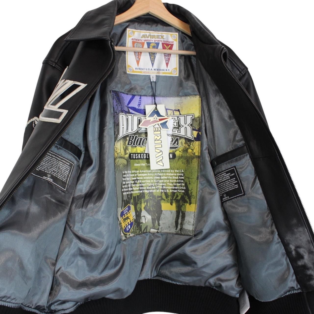 Avirex black leather jacket with Tuskegee Aces logo and full zip design.