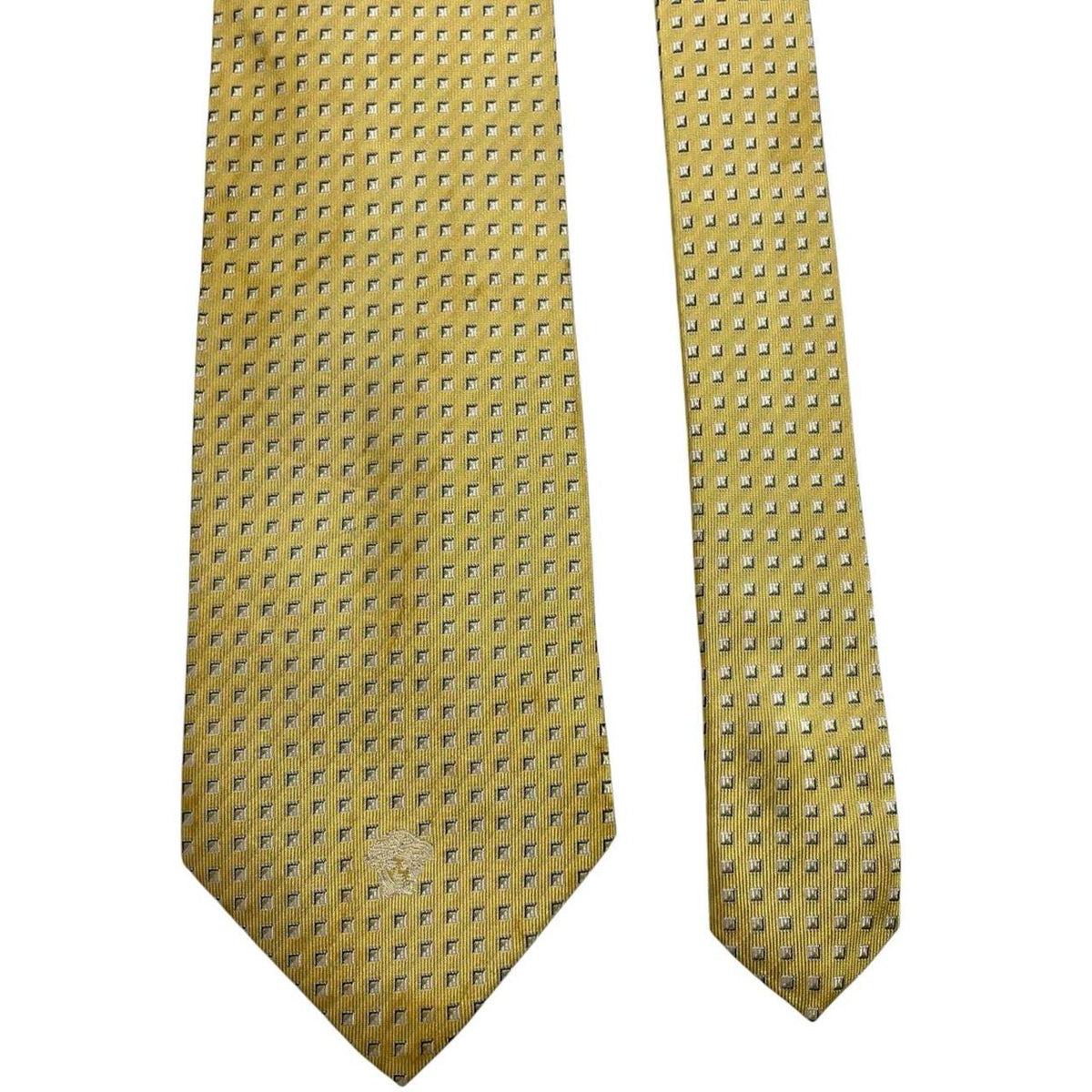 Versace yellow silk tie with subtle pattern and faint mark on front.