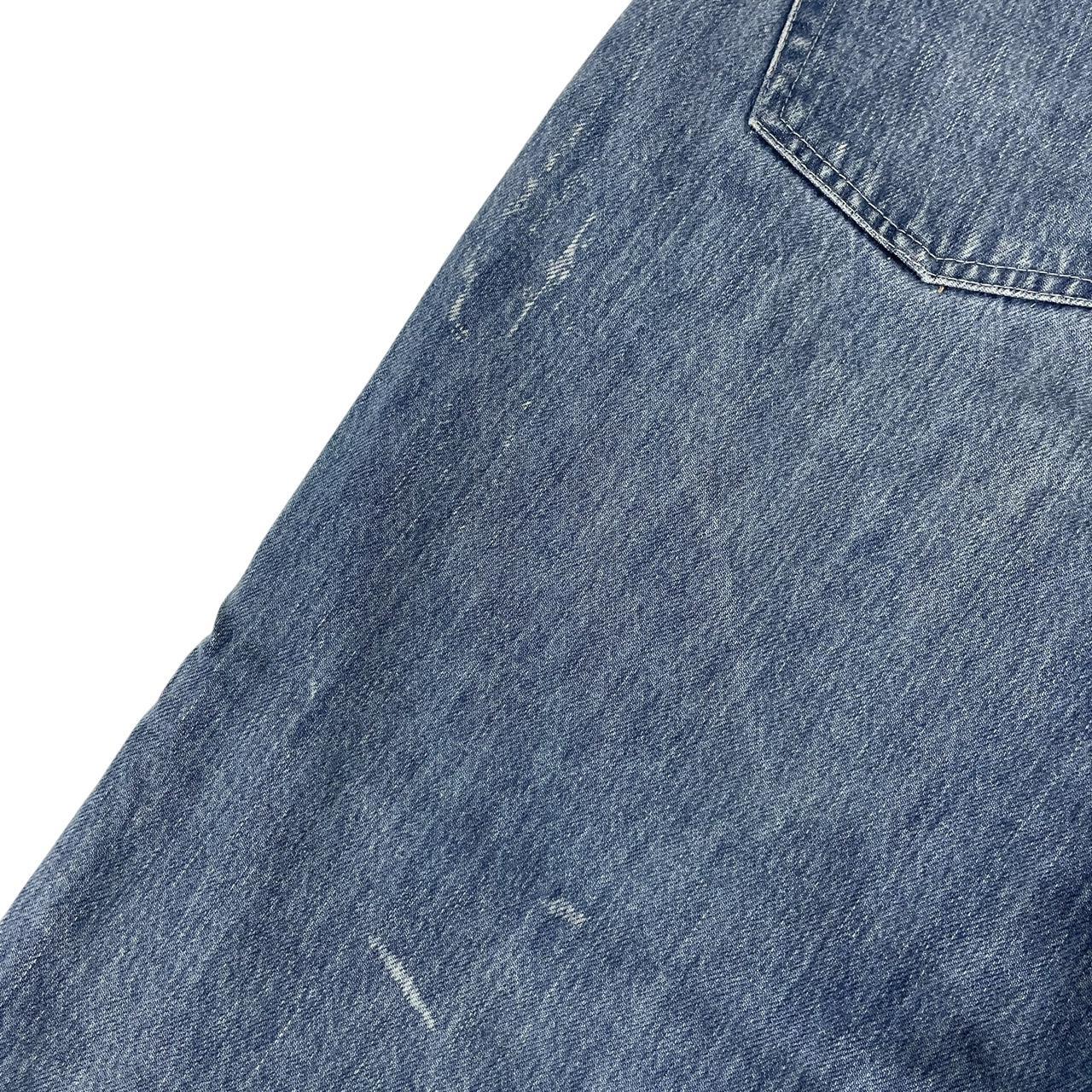 Palace blue straight jeans with mid stone wash and quacked pattern details.