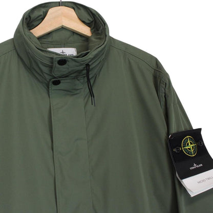 Stone Island green full zip jacket with packable hood and removable brand patch.