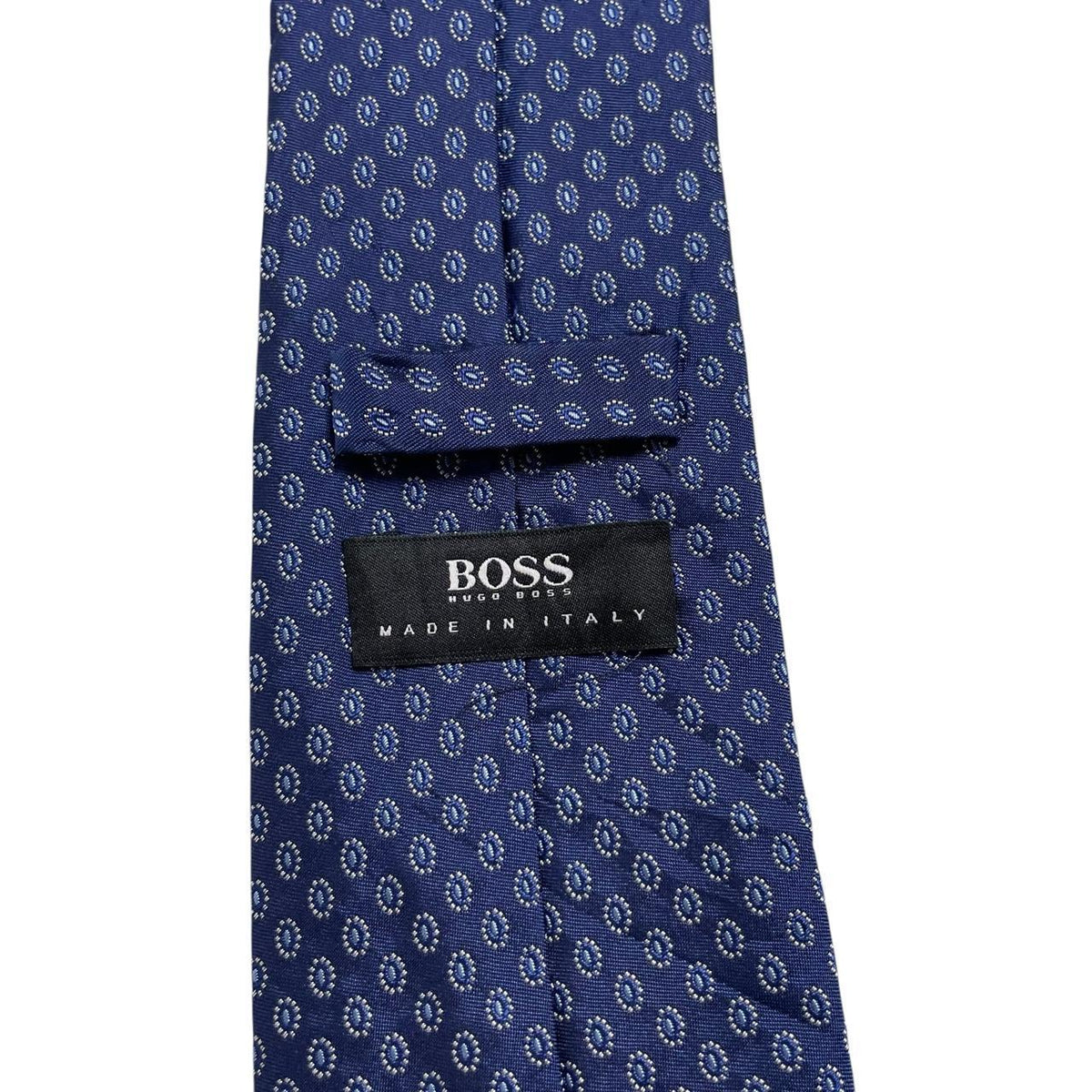 Hugo Boss blue silk tie with smooth texture and subtle sheen.