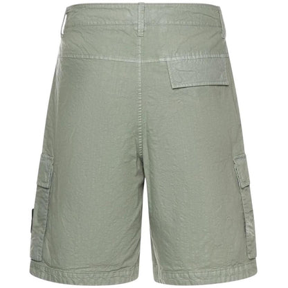 Stone Island green cargo shorts with multiple pockets and "OLD" effect garment-dye treatment.