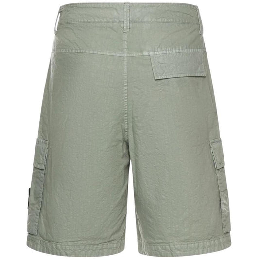 Stone Island green cargo shorts with multiple pockets and "OLD" effect garment-dye treatment.