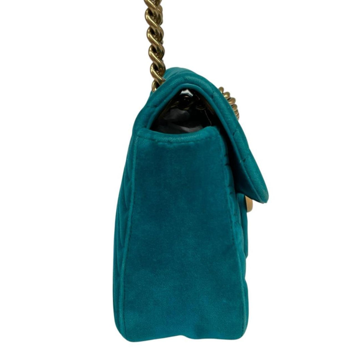 Gucci turquoise velvet shoulder bag with gold GG logo and green accents.