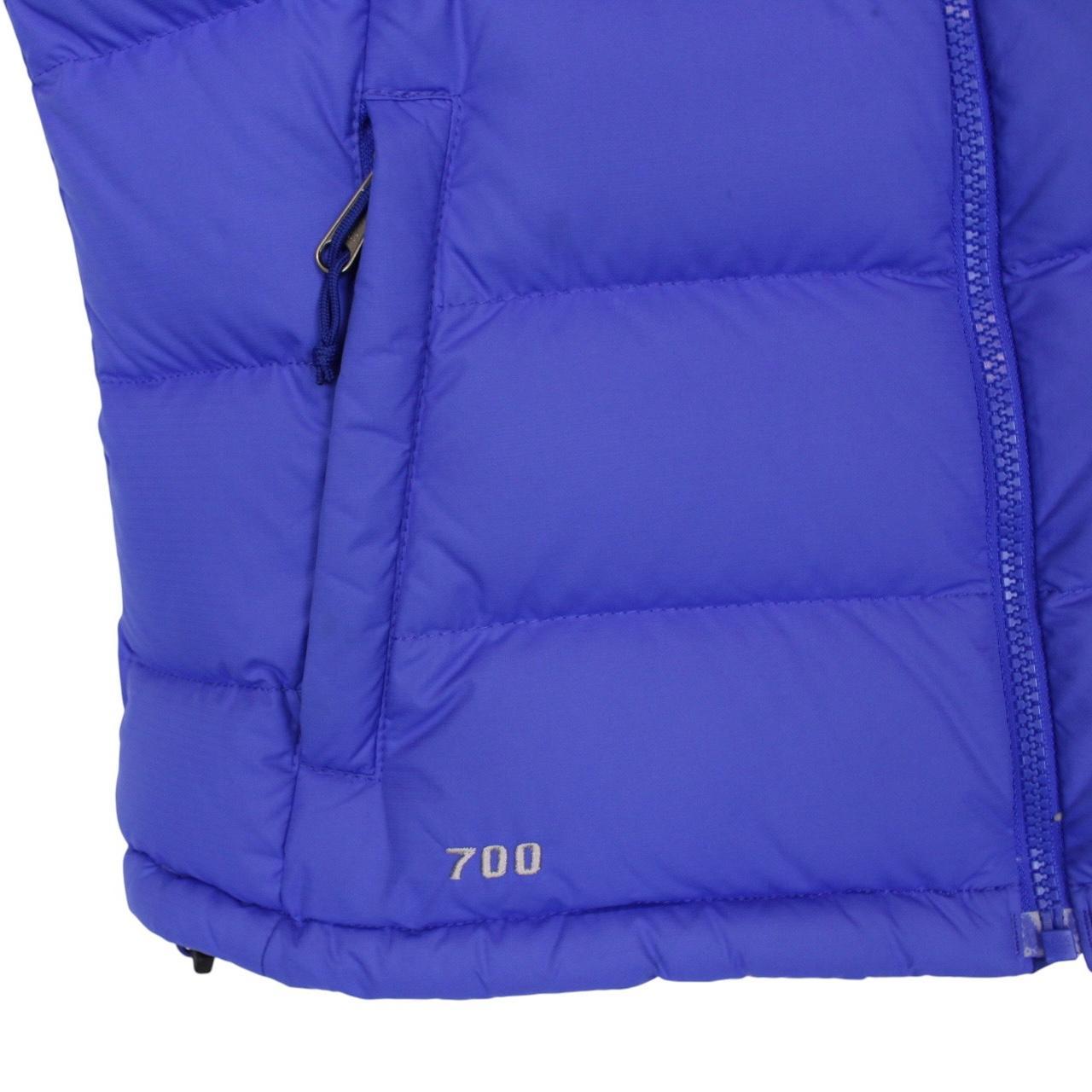 The North Face blue down gilet with logo detail and quilted pattern.