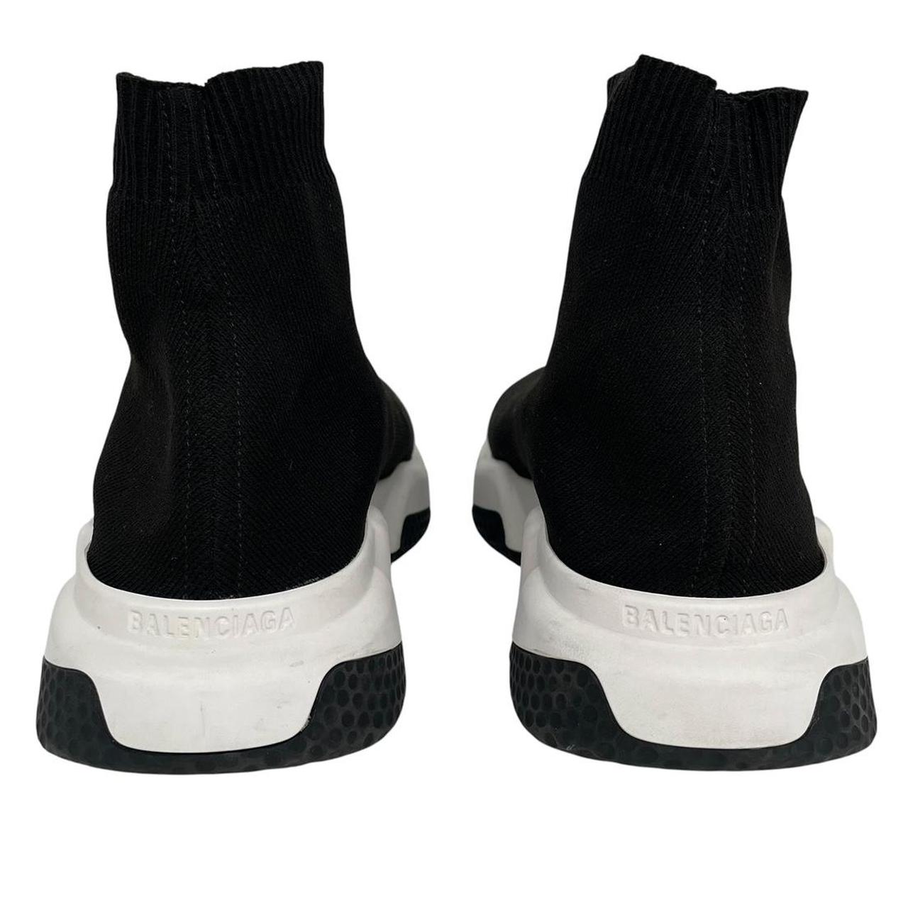 Balenciaga Speed 2 black and white trainers with logo detailing and cotton material.