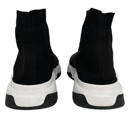 Balenciaga Speed 2 black and white trainers with logo detailing and cotton material.