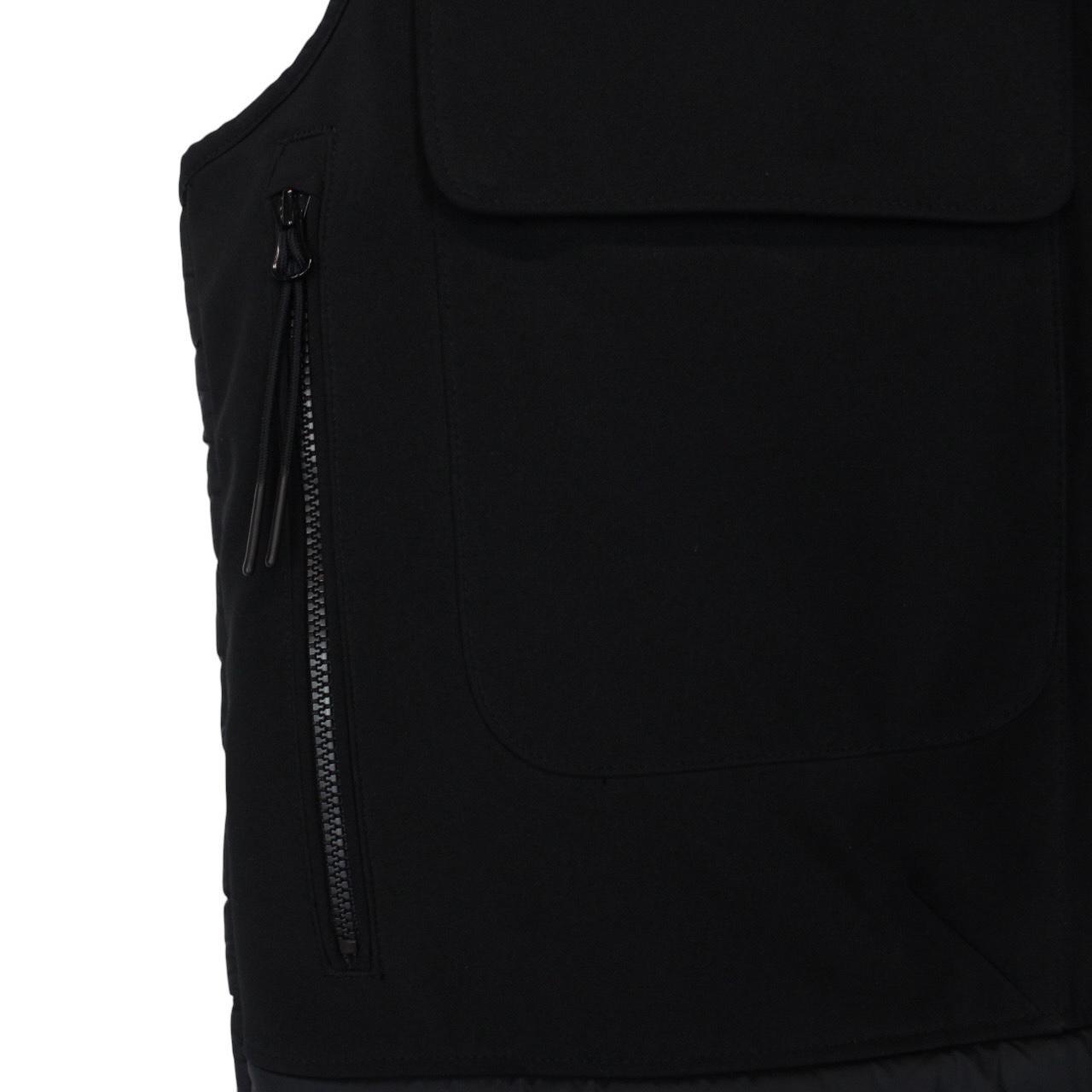 CP Company black goggle gilet with logo detail and shell material.