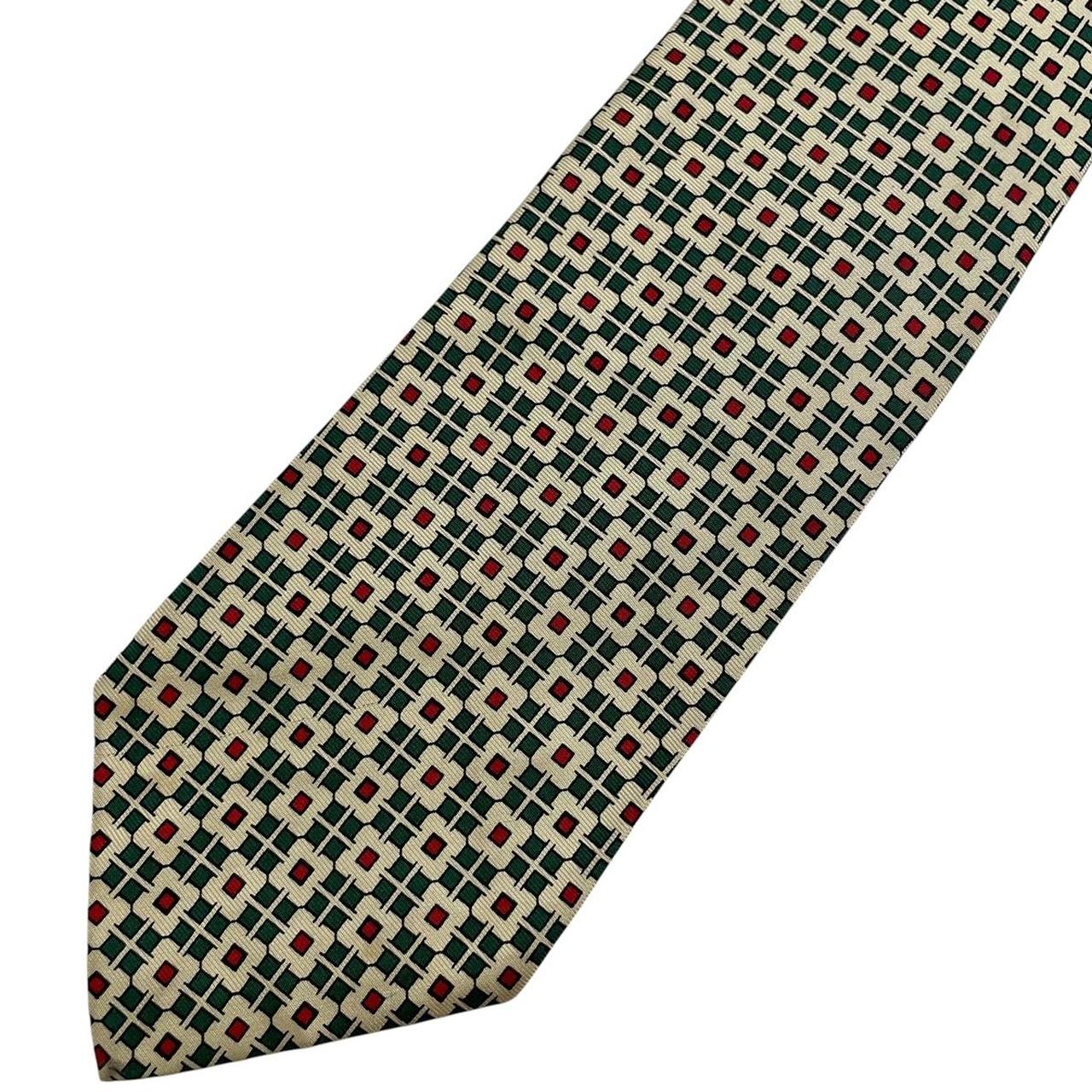 Polo Ralph Lauren yellow silk tie with geometric print design and logo detail.