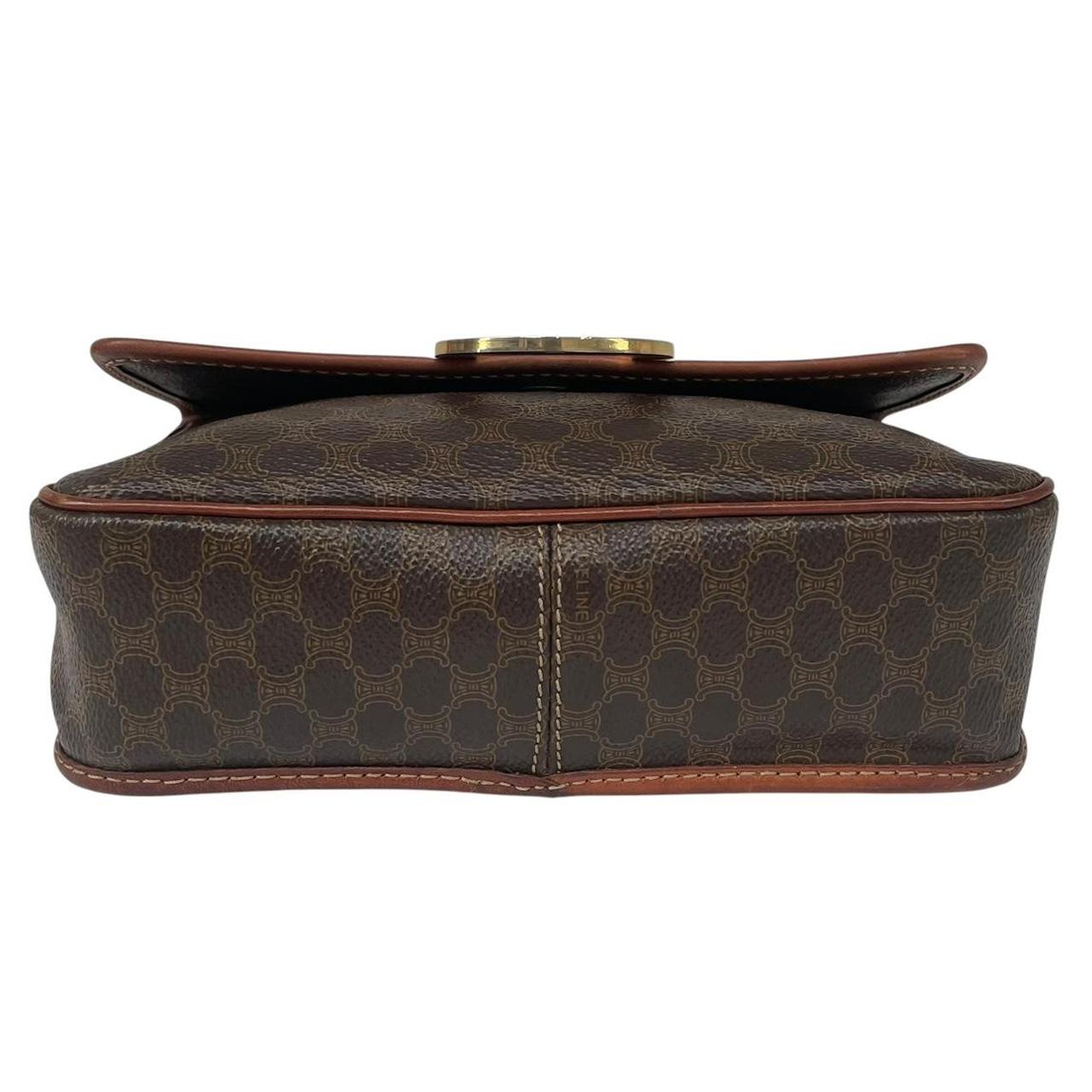 CELINE brown duffel bag with Macadam canvas pattern and logo detail.