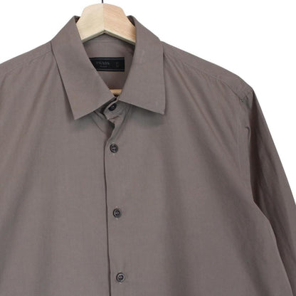 Prada brown long sleeve shirt with popeline stretch fabric and logo detail.