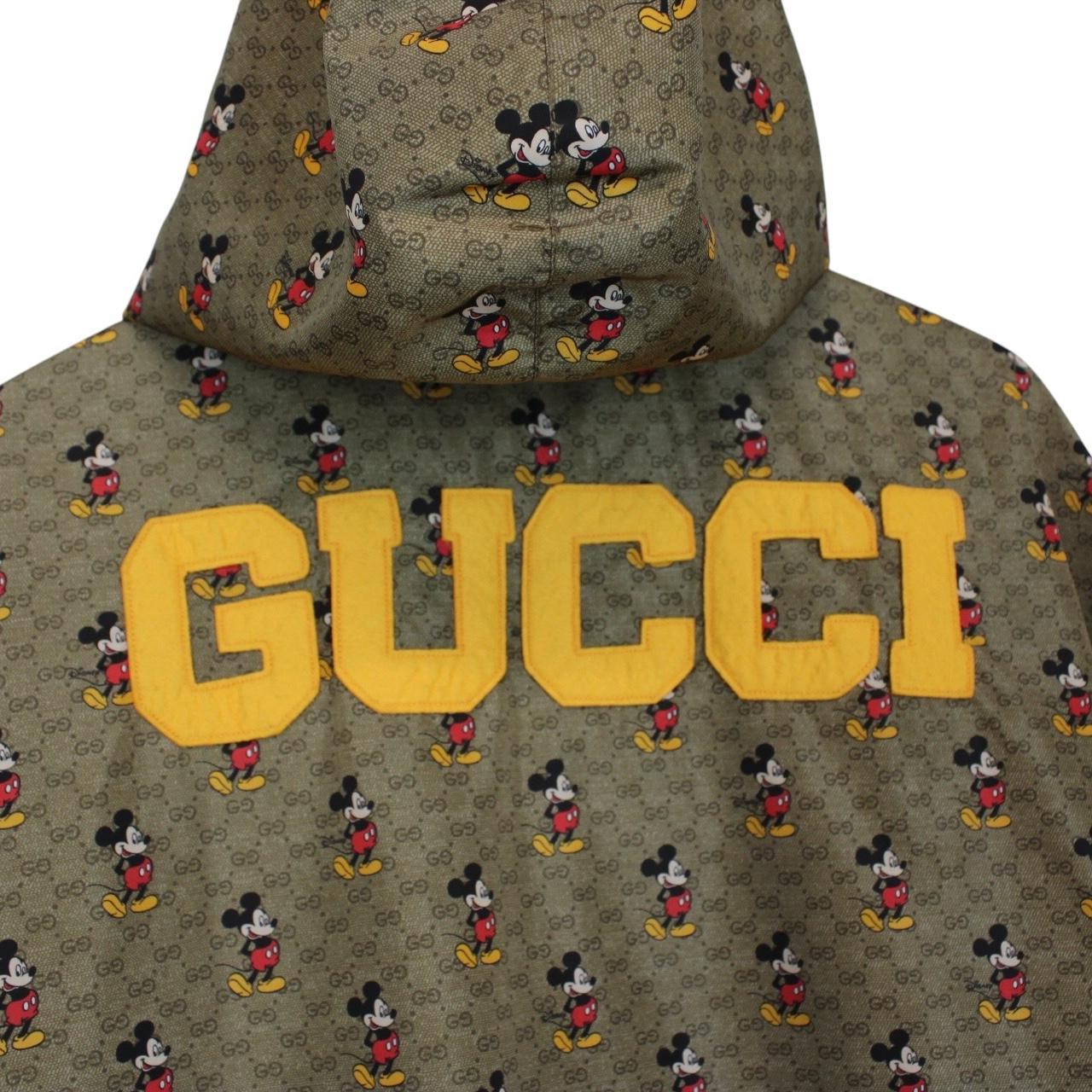 Gucci x Disney khaki brown windbreaker jacket with monogram pattern and nylon material.