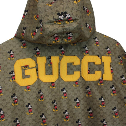 Gucci x Disney khaki brown windbreaker jacket with monogram pattern and nylon material.