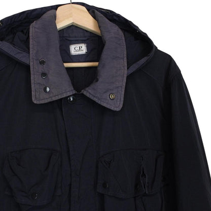 CP Company navy blue nylon jacket with multi pockets and garment dyed finish.