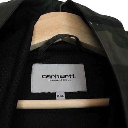 Carhartt camouflage hooded pullover jacket with logo and durable material.