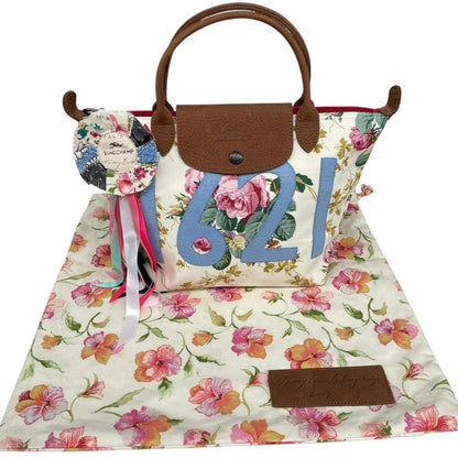 Longchamp multi tote bag featuring Tracey Emin artwork and iconic foldable design.