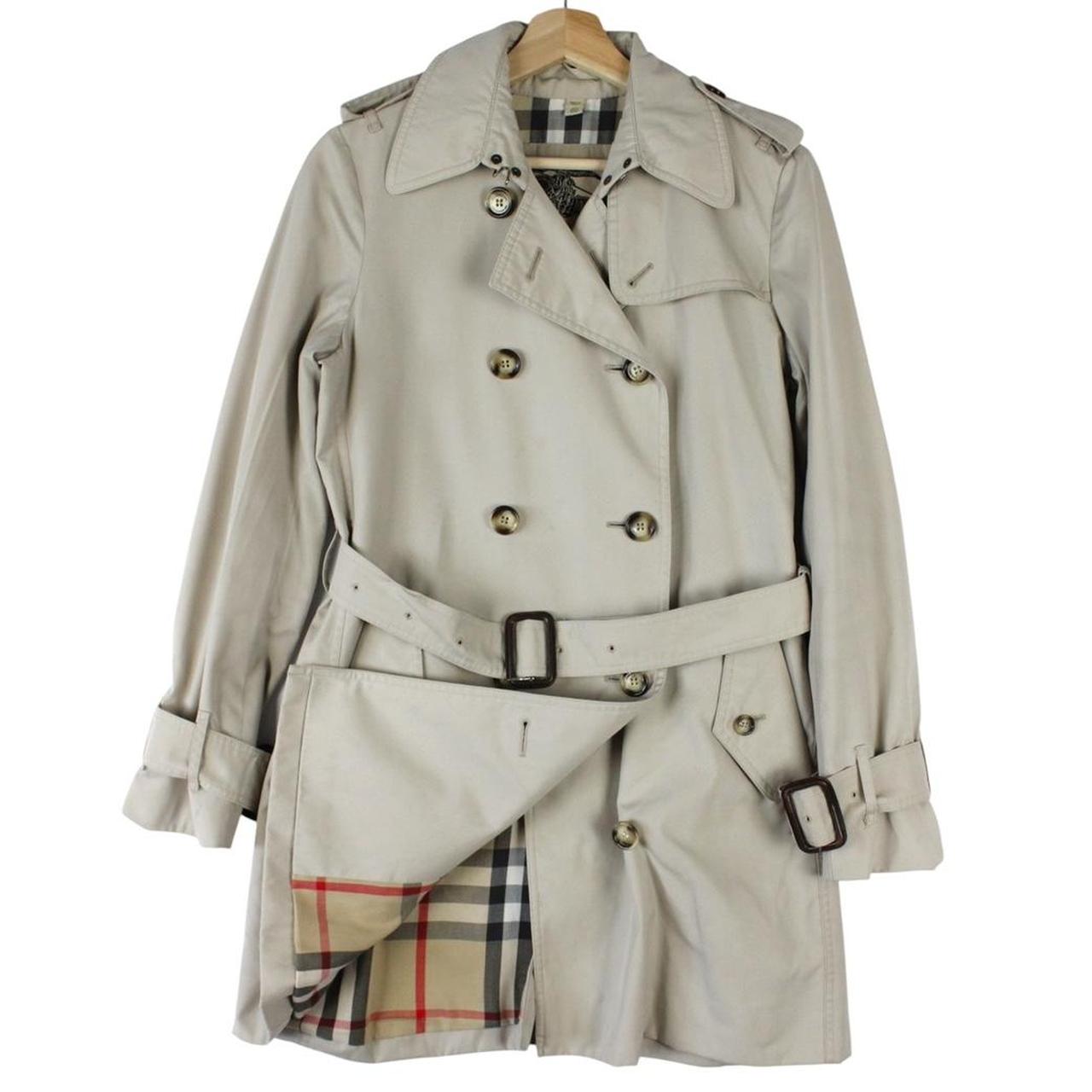 Burberry beige trench coat featuring Nova Check pattern and double-breasted design with belt.