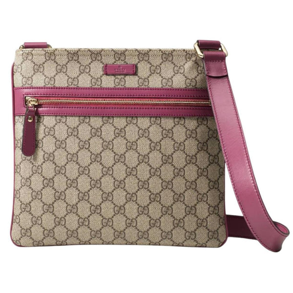 Gucci beige and pink duffel bag with GG Supreme monogram canvas pattern.