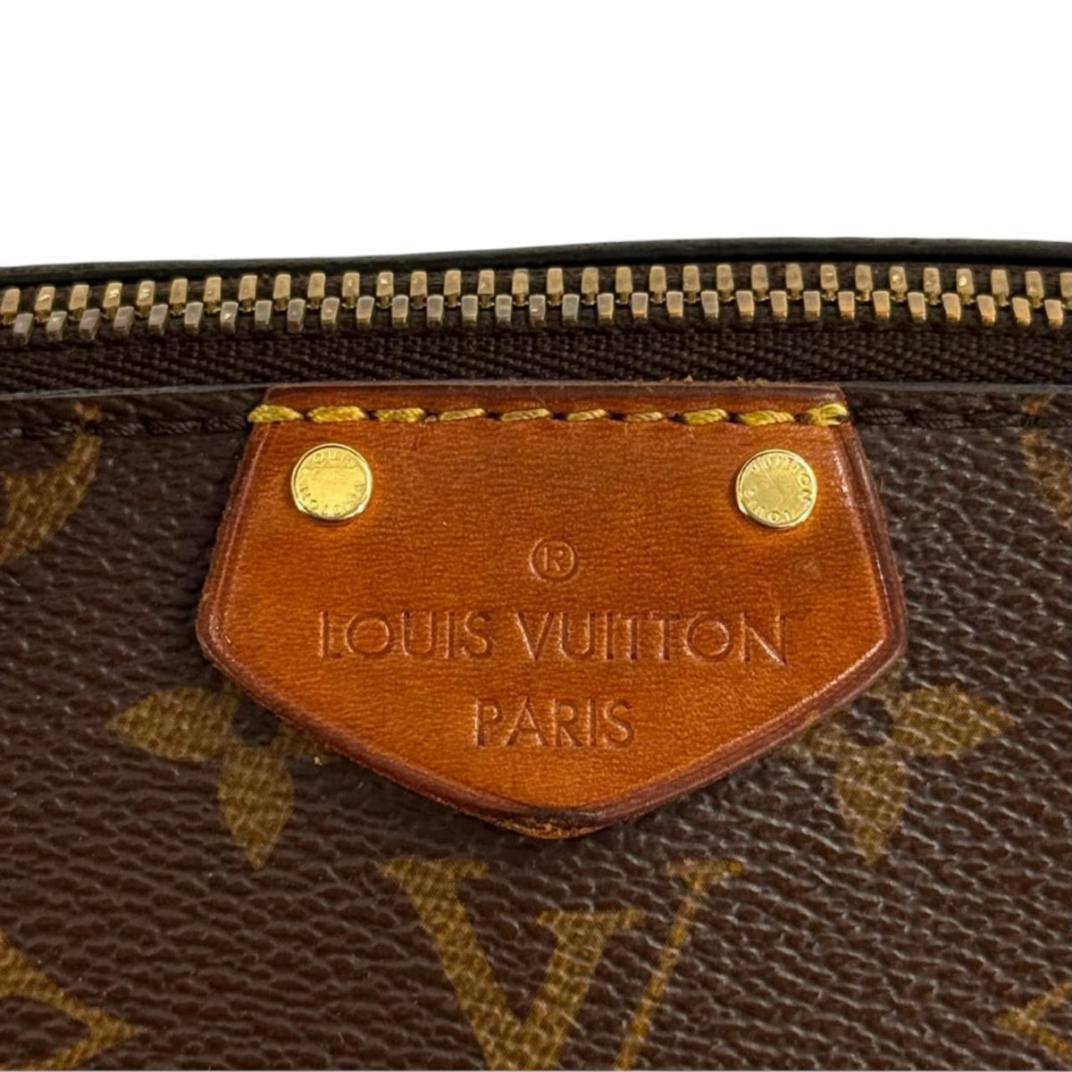 Louis Vuitton brown messenger bag with monogram canvas and leather trim details.