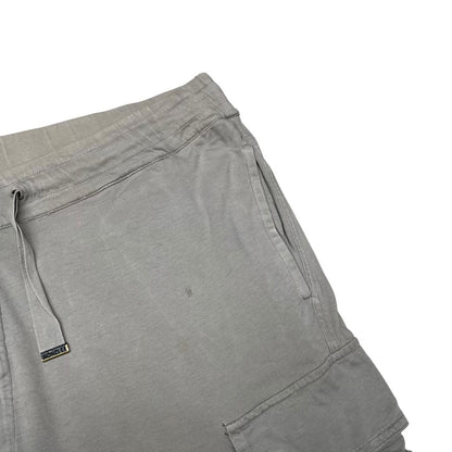Moncler grey jogger shorts cotton material with logo detail and minor marks.