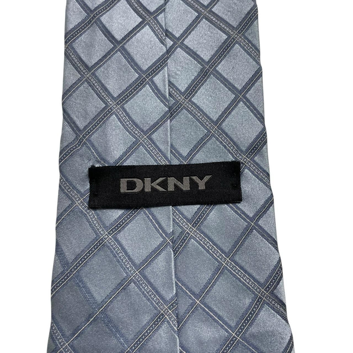DKNY light blue silk tie with subtle sheen and vintage design.
