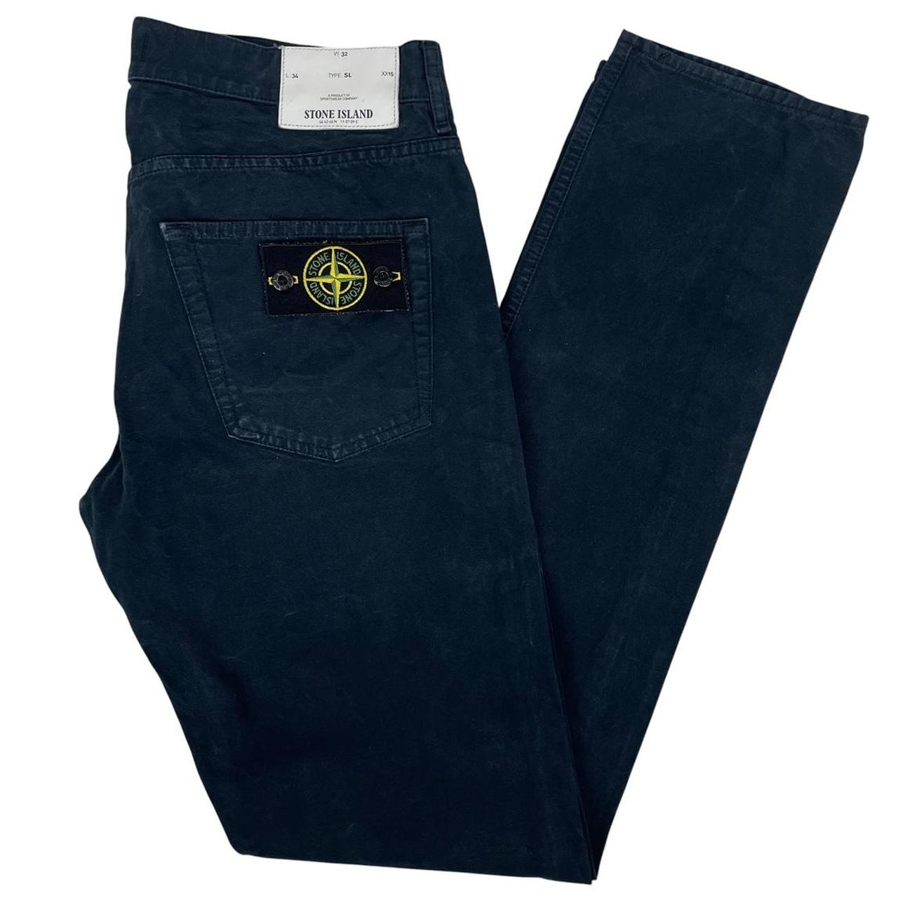 Stone Island navy blue slim fit cotton trousers with logo patch and side pockets.