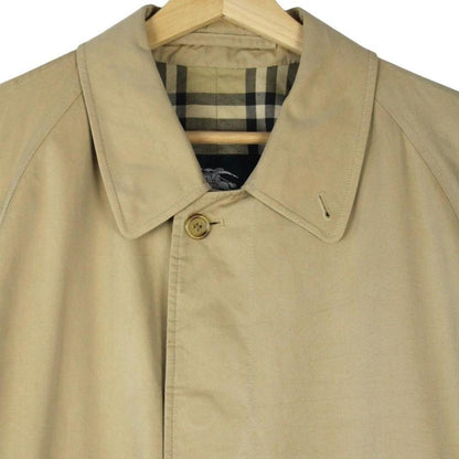 Burberry tan brown single breasted cotton overcoat with logo detail and classic design.