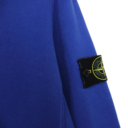 Stone Island blue cotton sweatshirt with logo patch and ribbed cuffs.