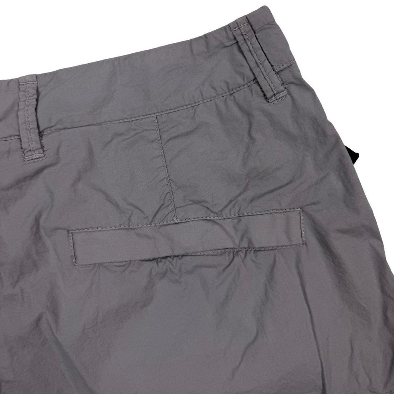 Stone Island grey cargo shorts with logo patch and multiple pockets in cotton material.