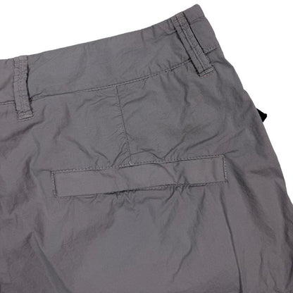 Stone Island grey cargo shorts with logo patch and multiple pockets in cotton material.