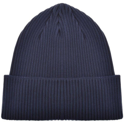 CP Company navy blue beanie hat with goggle detail and cotton material.